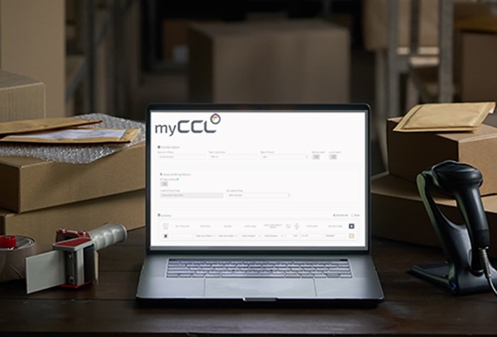 myCCL Transport Management System showing automated Commercial Invoice management on a laptop screen